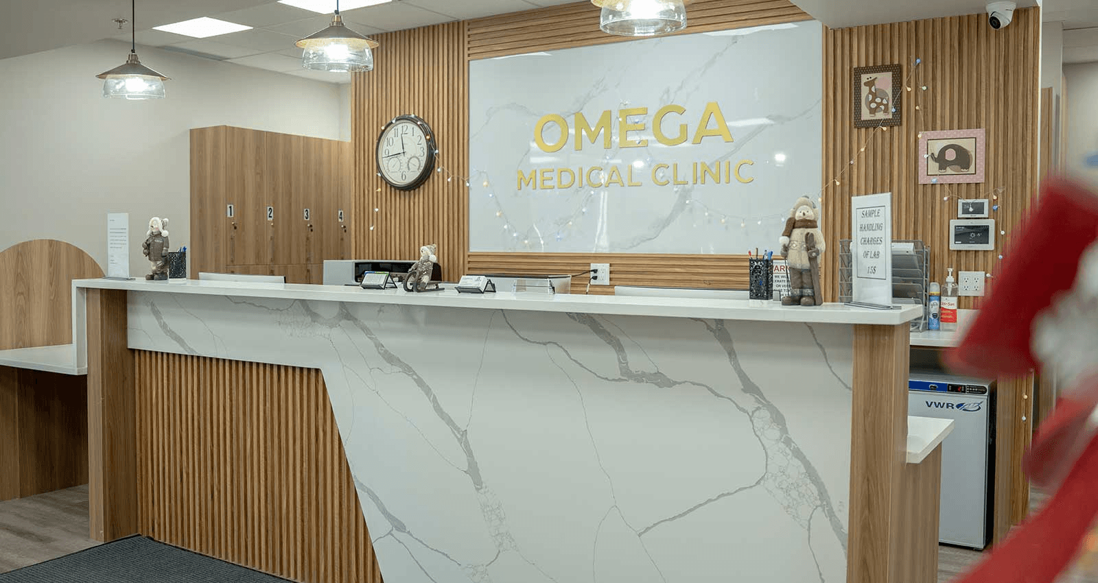Omega Medical Clinic Reception - Modern front desk with logo in NE Calgary